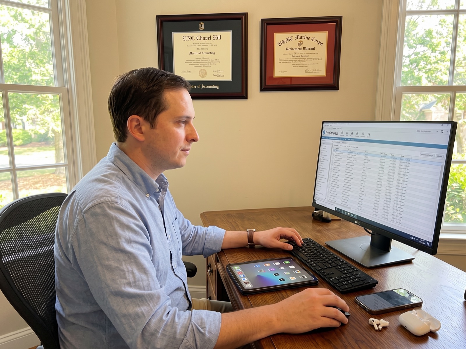 An accountant reviewing financial reports at a computer