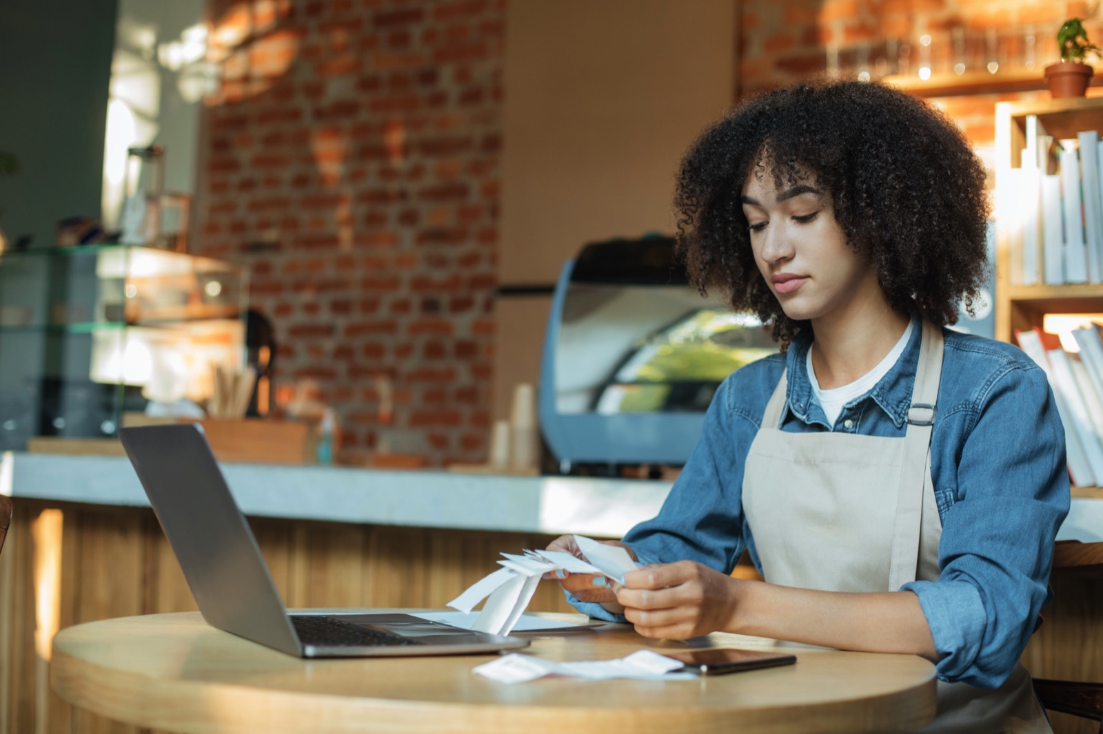 Receipts and a calculator arranged for bookkeeping review