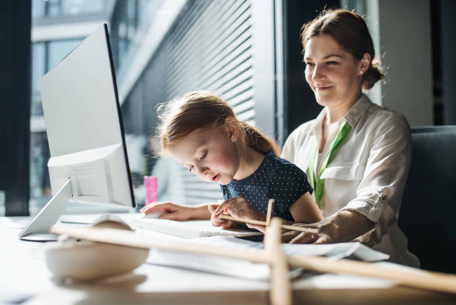 A parent and child using a computer together