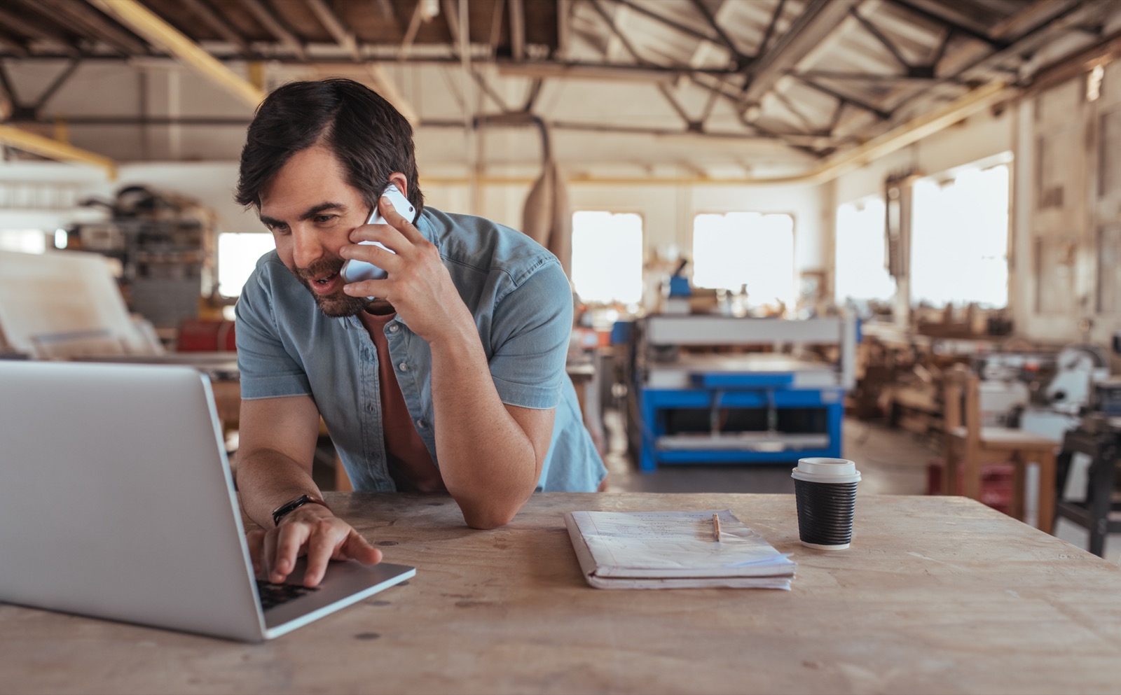 A business owner discussing growth plans by phone
