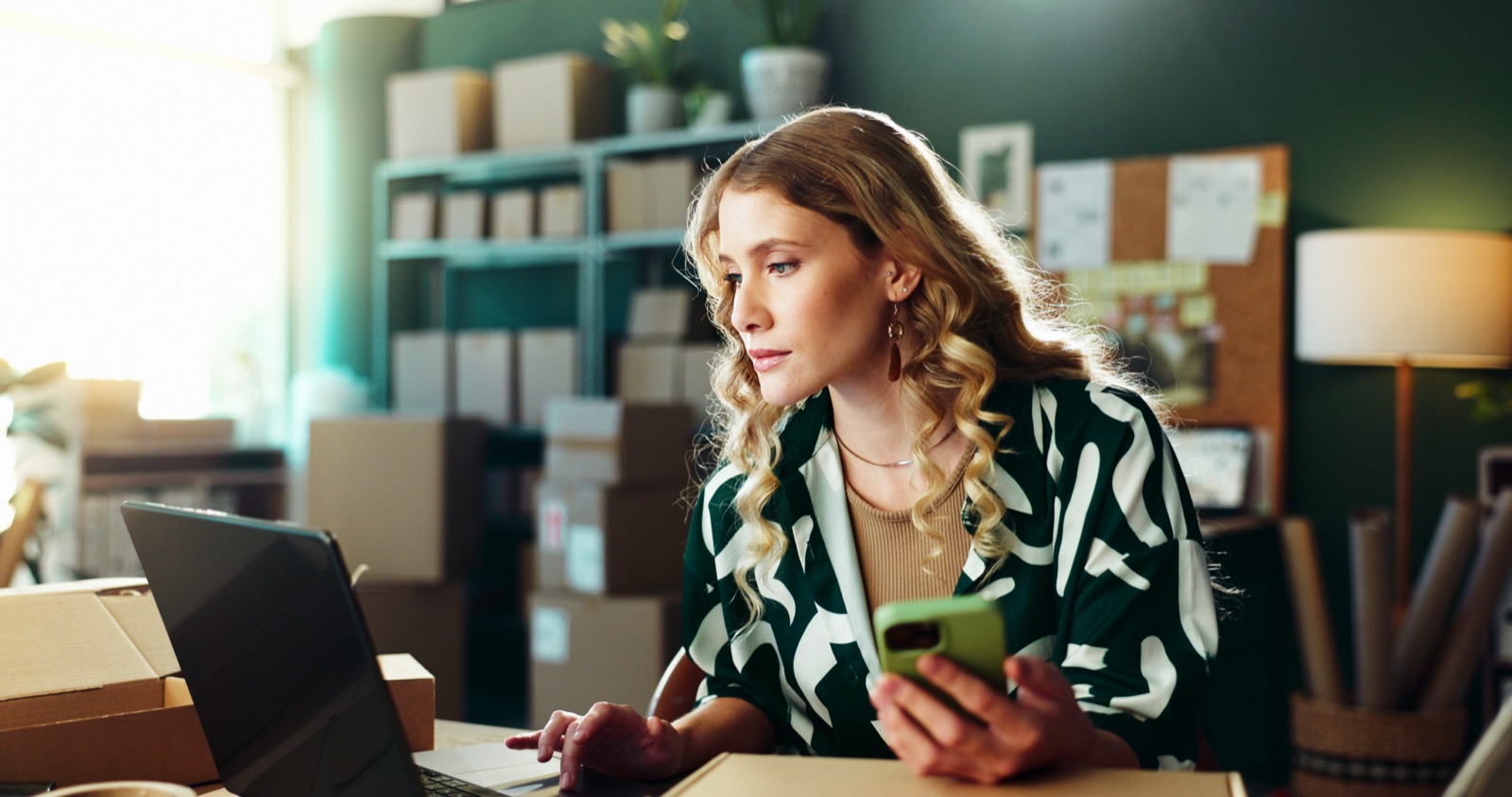 A business owner reviewing financial results on a laptop