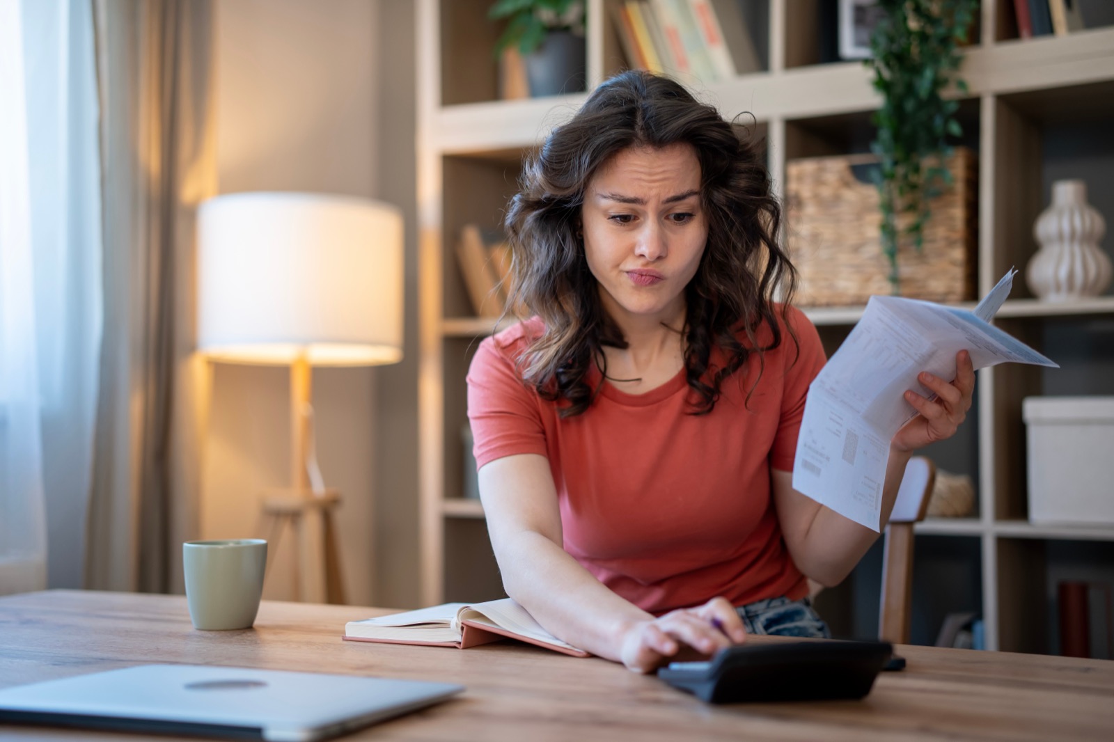 A taxpayer reviewing paperwork at home